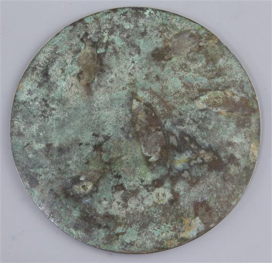 A Chinese bronze circular TLV mirror, Han dynasty, 1st century B.C., 13.5cm diameter, small filled hole